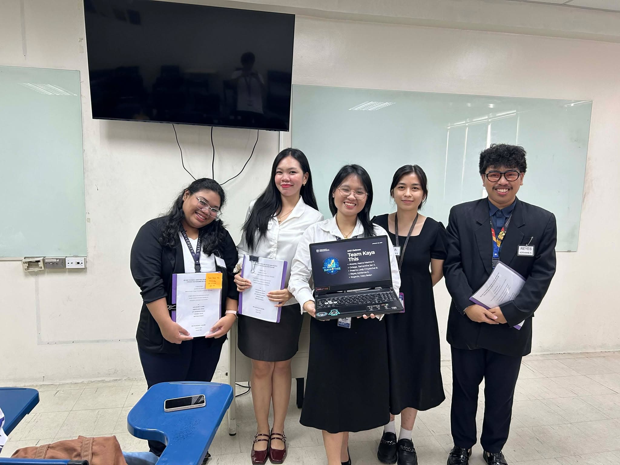 The five NGINIG creators presenting their defended capstone project